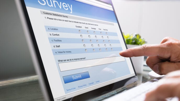 Man Giving Online Survey On Laptop | Meridian Source
