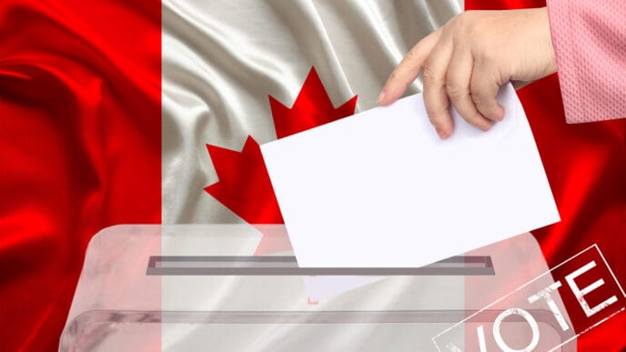 Female,Voter,Drops,A,Ballot,In,A,Transparent,Ballot,Box | Meridian Source