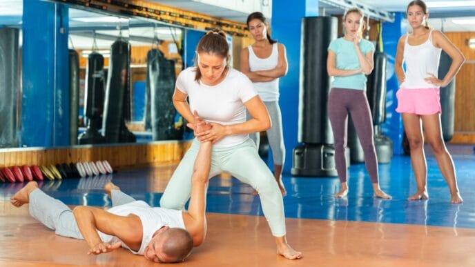 Concentrated,Hispanic,Female,Practicing,Effective,Self,Defence,Techniques,With,Coach | Meridian Source