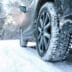 Snowy country road with car on winter day closeup Space for te | Meridian Source