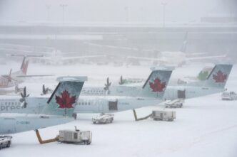 Snowstorm wreaks havoc on air travel plans, as hundreds more flights cancelled