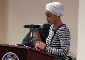 Man sprays unknown substance on Rep. Ilhan Omar and is tackled at Minneapolis town hall