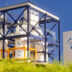 concept of a SMR small modular nuclear reactor power plant on a sunny day SMR is a future energy concept 3d rendering | Meridian Source