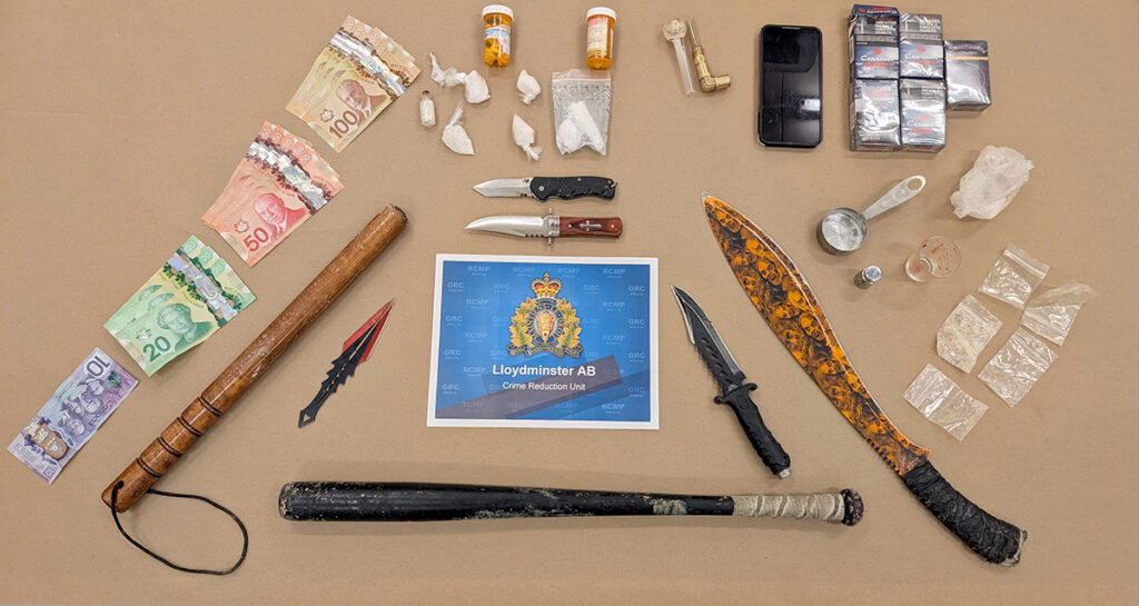 Two charged after stolen vehicle, drugs and weapons seized in ...
