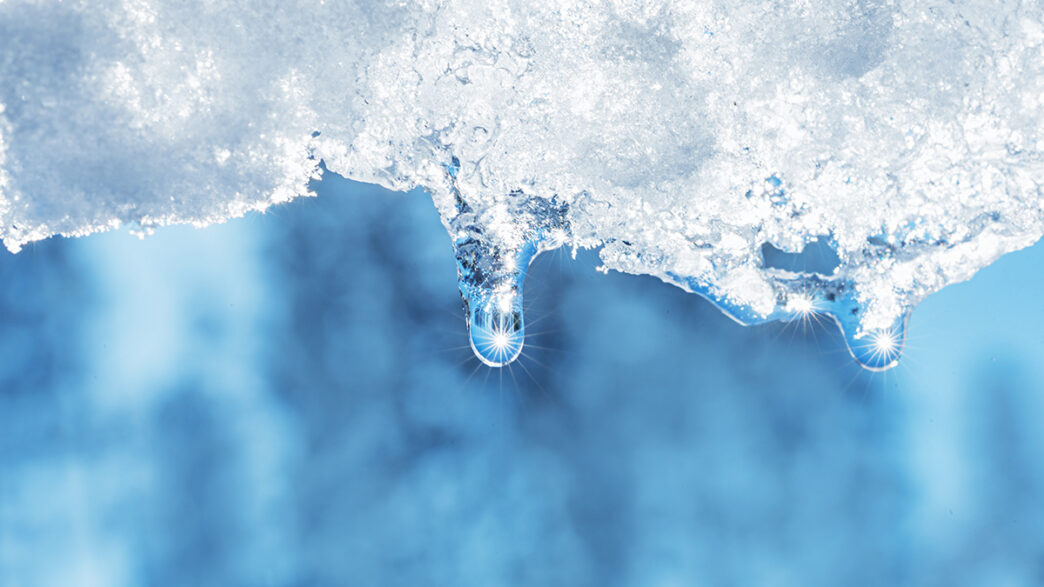 closeup of melting snow with sun reflection | Meridian Source
