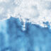 closeup of melting snow with sun reflection | Meridian Source