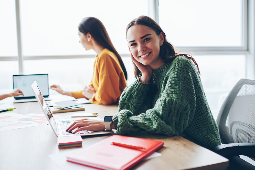 Portrait of cheerful caucasian woman learning via laptop compute | Meridian Source