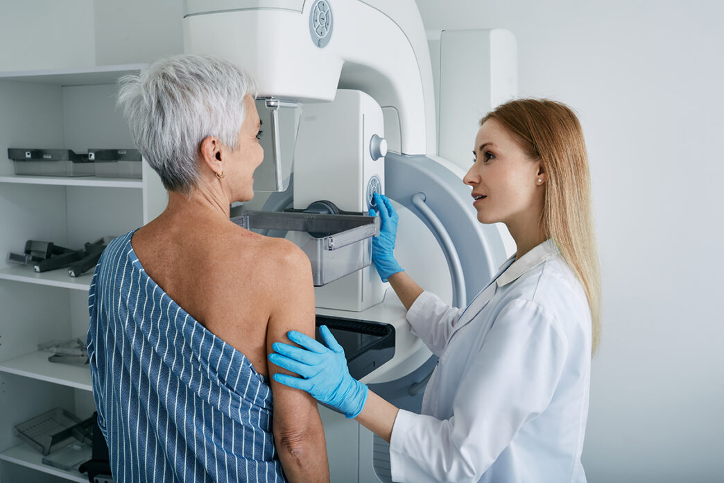 Senior woman having mammography scan at hospital with medical technician Mammography procedure breast cancer prevention | Meridian Source