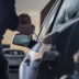 Auto thief in black balaclava trying to break into car | Meridian Source