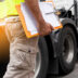 truck driver hand holding clipboard inspecting safety daily chec | Meridian Source