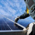 Male worker repairing photovoltaic solar panel | Meridian Source